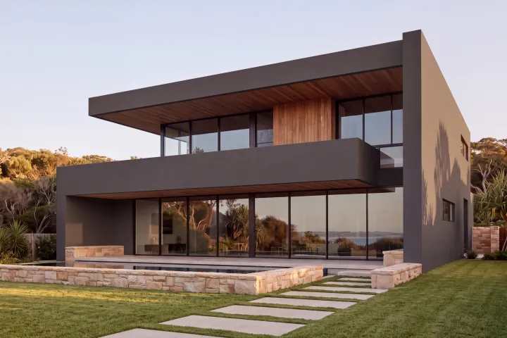 The home with every rendered surface in Dulux Black Caviar, a deep charcoal.