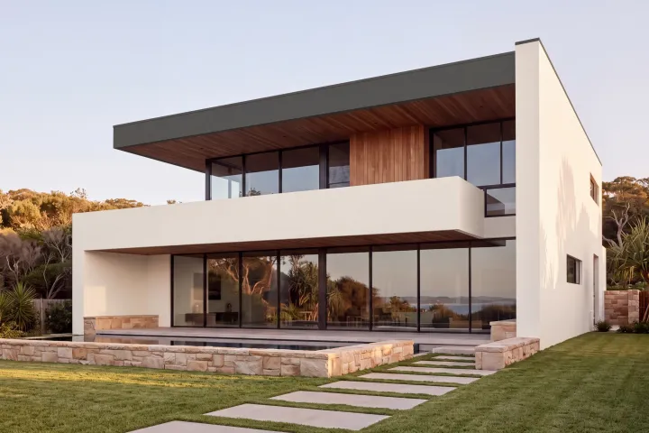 The home in Dulux Berkshire White with the roof slab edge in Colorbond Woodland Grey.
