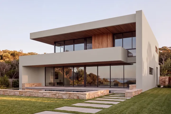 The home with every rendered surface in Colorbond Dune, a warm light grey.