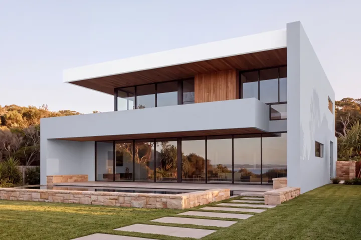 The home in Dulux Miller Mood, a pale cool grey, with the roof slab edge in Lexicon Half.