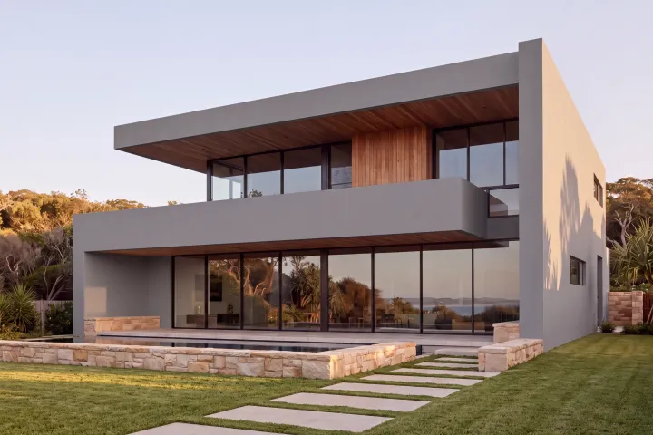 The home with every rendered surface in Colorbond Basalt, a mid grey.